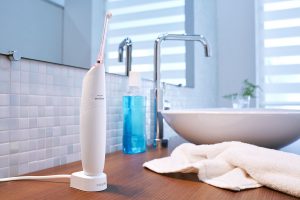 airfloss ultra pink front charger mouthwash evt carger scher